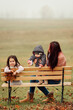 Mother with two girls outdoors in the park