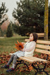 child sitting on a bench in the park