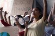 © Tamia Studio - Female hispanic latin teenager students with placards and posters on global protest for climate change and Earth rights