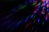 Fototapeta Tęcza - abstract colorful ray lights on dark background