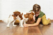 © Rodica - Happy child playing and embracing his puppy indoor. Teen boy with his puppy. Best friend and pet. Lovely dog