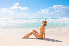 Young Slim Woman In Bikini Lying On Tropical Beach Sunbathing Under Summer Sun