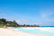 Sandy Beach With Palm Trees And Granite Boulders In Anse North, La Digue Island, Seychelles. Tropical Destination