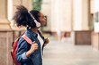 © Prostock-studio - African American Female Student Posing Near University Building Outdoors