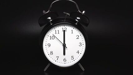 Wall Mural - Black vintage alarm clock with two bells on black background