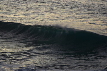 Wall Mural - waves at sunset in the Canary Island contemplating its colors and horizon