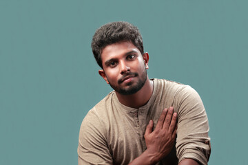 Wall Mural - Portrait of a smiling young man of Indian origin