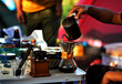 © Taweesak - Hand of camper pouring hot water to coffee cup for brew coffee drink to coffee drift in morning fresh between rest in holiday camp. Coffee drift with camping concept.