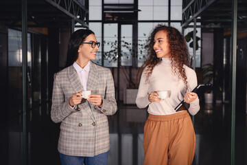 Poster - Coworkers talking during coffee break in office