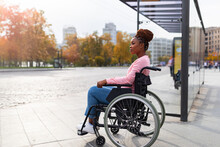 Black Paraplegic Woman In Wheelchair Waiting On Bus Stop, Cannot Board Vehicle Suitable For Handicapped Persons