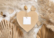 © katrinshine - Heart shaped Valentines present with square blank gift tag, pampas grass and hearts, boho Mockup