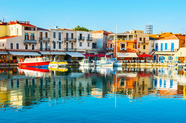 Sticker - The mirror reflection in waters of Rethymno port, Crete, Greece