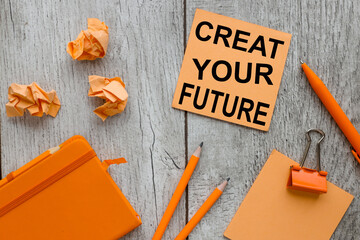 Create Your Future. text on orange sticky paper on a gray background