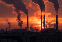 Smoke From Heating Station In Big City During Winter Season At Sunset. Smokestack Pipes Emitting Co2 From Coal Thermal Power Plant Into Atmosphere. Air Pollution And Emission Ecology Problem Concept
