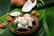 Kue Putu, Indonesian Traditional Cake Made From RIce Flour, Palm SUgar, Pandan Leaf, And Shredded Coconut. Come With Cylinder Shape With Bamboo Pipe
