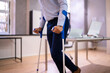 © Andrey Popov - Worker With Crutches At Workplace Or Office