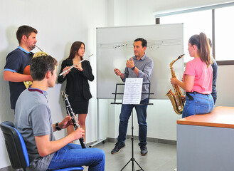 music conservatory teacher, corrects the lesson in the classroom.