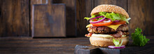 Hamburger With Bacon, Turkey Burger Meat, Cheese, Tomato And Lettuce On Wooden Background. Tasty Burger. Close Up