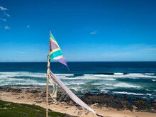 Ragged South African Flag At A Windswept Beach