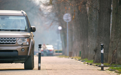 Sticker - Close up of a car parked illegally against traffic rules on pedestrian city street side