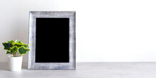 Blank Grey Vintage Wooden Frame On Table And White Wall Banckground , Banner, With Copy Space For Mock Up, Template