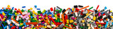 Fototapeta Kuchnia - top view of wide pile various mixed colorful rainbow colored stackable plastic toy bricks isolated white panorama background.. childhood education construction concept
