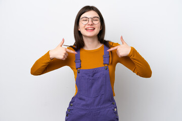 Wall Mural - Young Russian woman isolated on blue background proud and self-satisfied