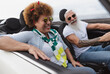 © Alessandro Biascioli - Happy senior couple having fun driving on new convertible car