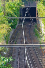 Railroad Tracks Leading To The Tunnel