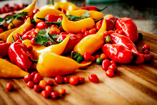 Red And Yellow Peppers On The Cutting Board