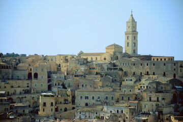 Poster - ITALY-Matera is a city located on a rocky outcrop in Basilicata, in Southern Italy. It includes the Sassi area, a complex of Cave Houses carved into the mountain