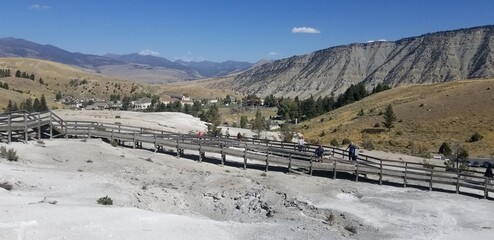 Wall Mural - Tourists on the Boardwalk Mammoth Hot Springs overlooking Mount Everts