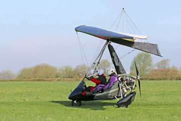 Poster - Ultralight airplane taxiing on a farm strip	