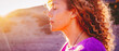 © simona - Close up sunset portrait of attractive woman with closed eyes and sun in back light. Dreaming and enjoying feeling concept lifestyle emotion. Serene female people outdoor with curly hair