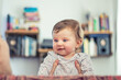 © Alexander - happy toddler kid at home smiling in living room