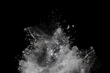 White powder explosion on black background. Colored cloud. Colorful dust explode. Paint Holi.