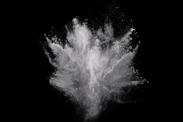 Wall Mural - White powder explosion on black background. Colored cloud. Colorful dust explode. Paint Holi.