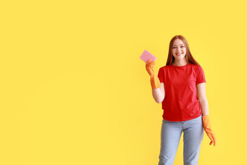 Wall Mural - Young woman with sponge on color background