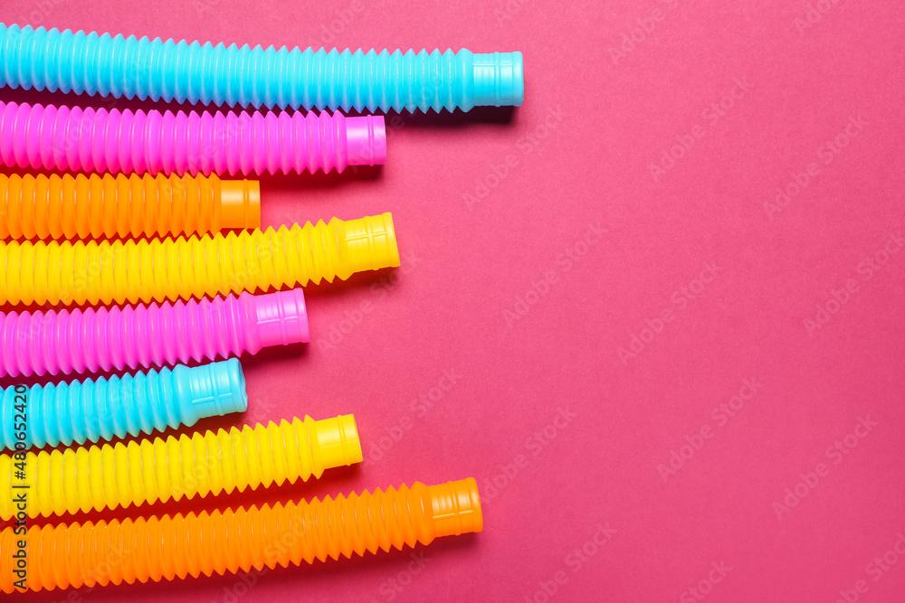 Different Pop Tubes on color background