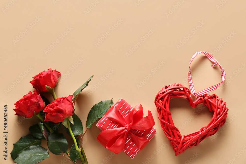 Red rose flowers, gift box and decor on color background. Valentine's Day celebration