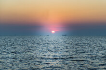 Beautiful Sunset Over A Calm Sea With A Blue And Orange Glowing Sky. Space For Text, Selective Focus.