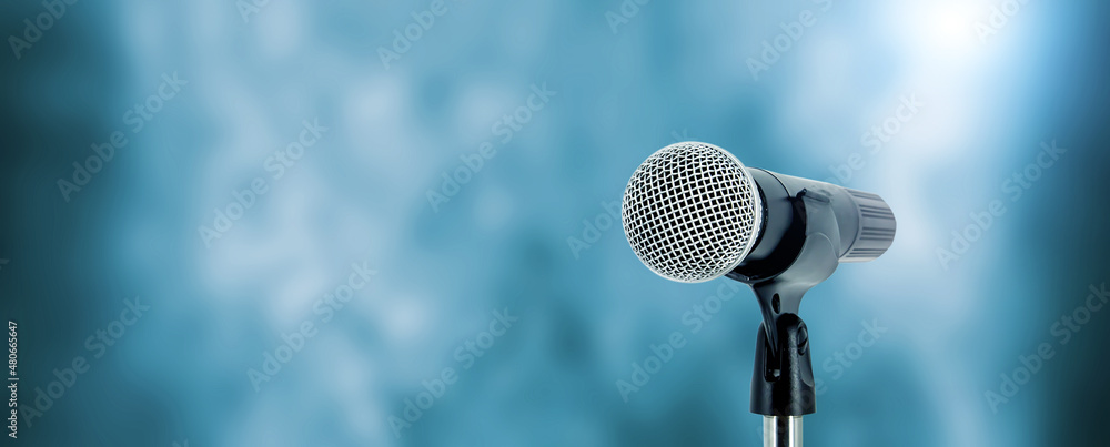 Microphone with stage light background for performance concept of ...