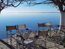 Sea Sky Deep Blue In Winter Sunny Day Bench Chairs By The Beach Tree In Menidi  Near To Arta City Greece