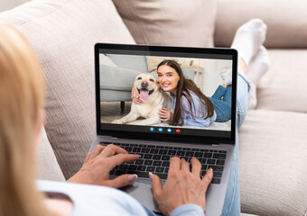 Sticker - Unrecognizable Lady Having Video Call With Female Friend While Relaxing On Couch