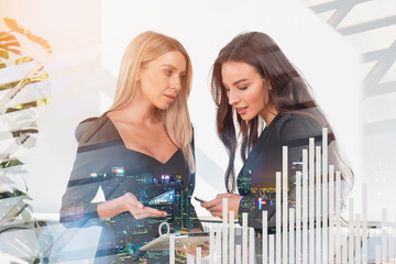 Poster - Businesswoman with tablet and phone, bar chart hologram with skyscrapers