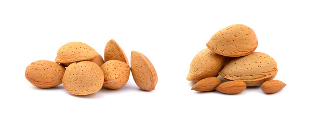 Wall Mural - Heap of fresh almonds in shells isolated on white background