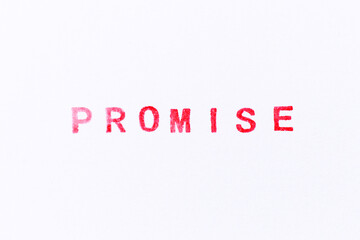 Red color ink rubber stamp in word promise on white paper background