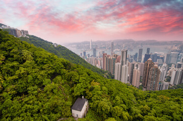 Canvas Print - Downtown Hong Kong panoramic view from Victoria Peak viewpoint at sunset.