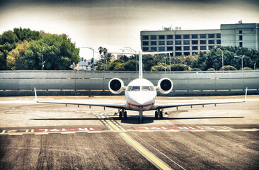 Wall Mural - Small airplane on the runway, ready to takeoff