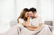 © dusanpetkovic1 - Joyful morning couple cuddling in their bed at the bedroom.